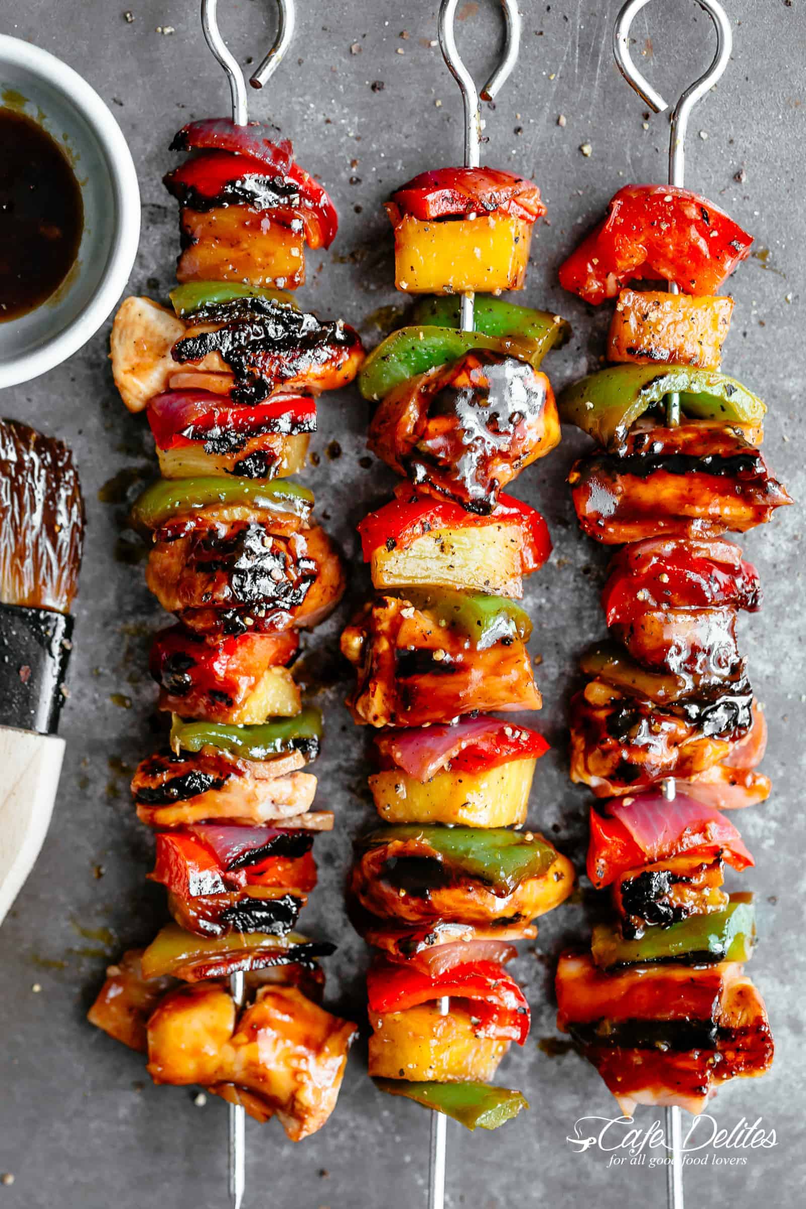 Hawaiian Bacon Pineapple Chicken Kebabs with a BBQ twist! Crispy bacon and chicken smothered in a Hawaiian style pineapple and barbecue sauce