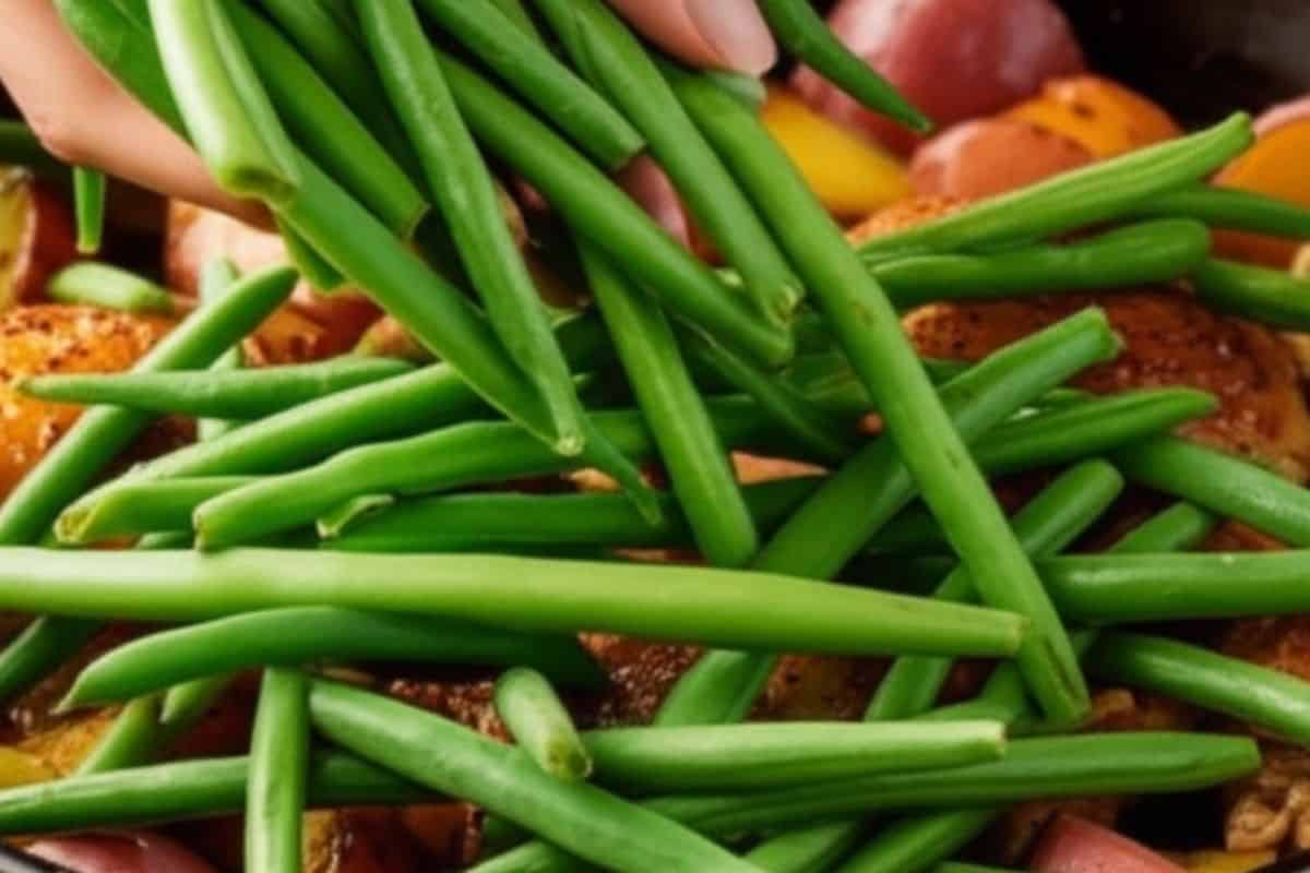add green beans and stir them into the pan after 30 minutes of baking