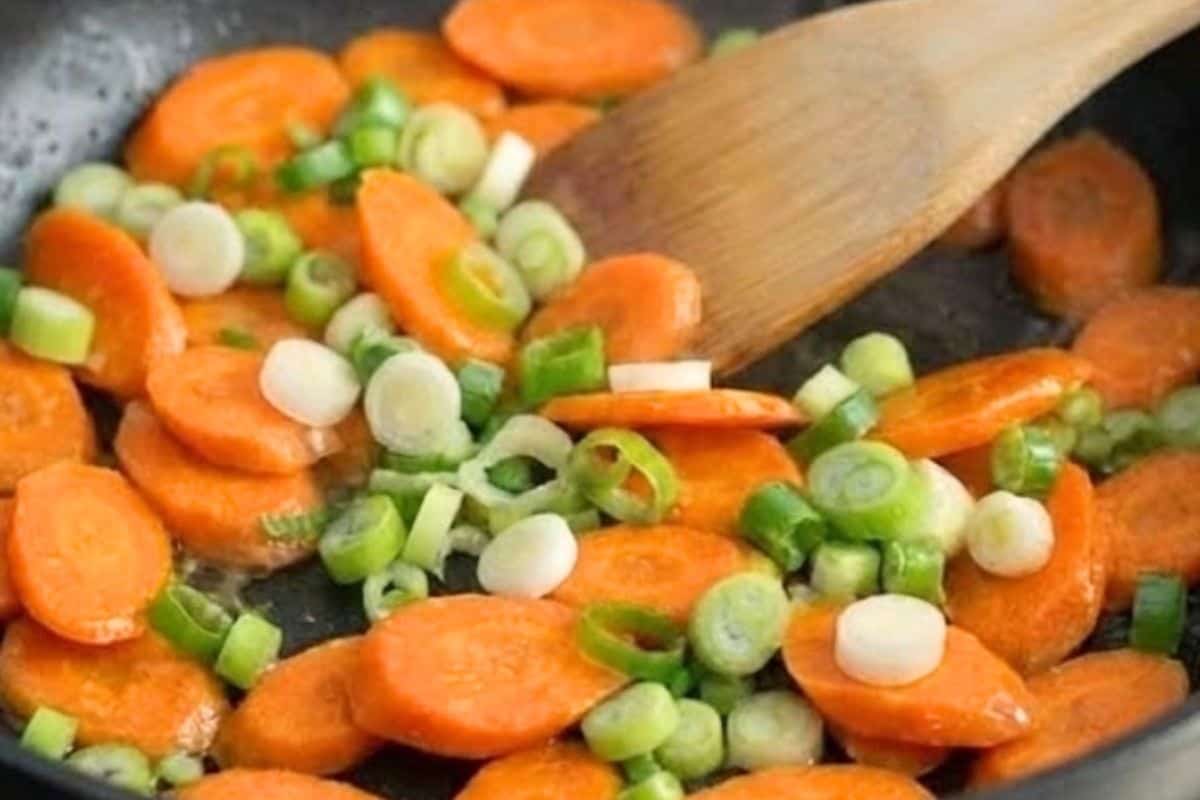 Add shallots or green onions and the carrots