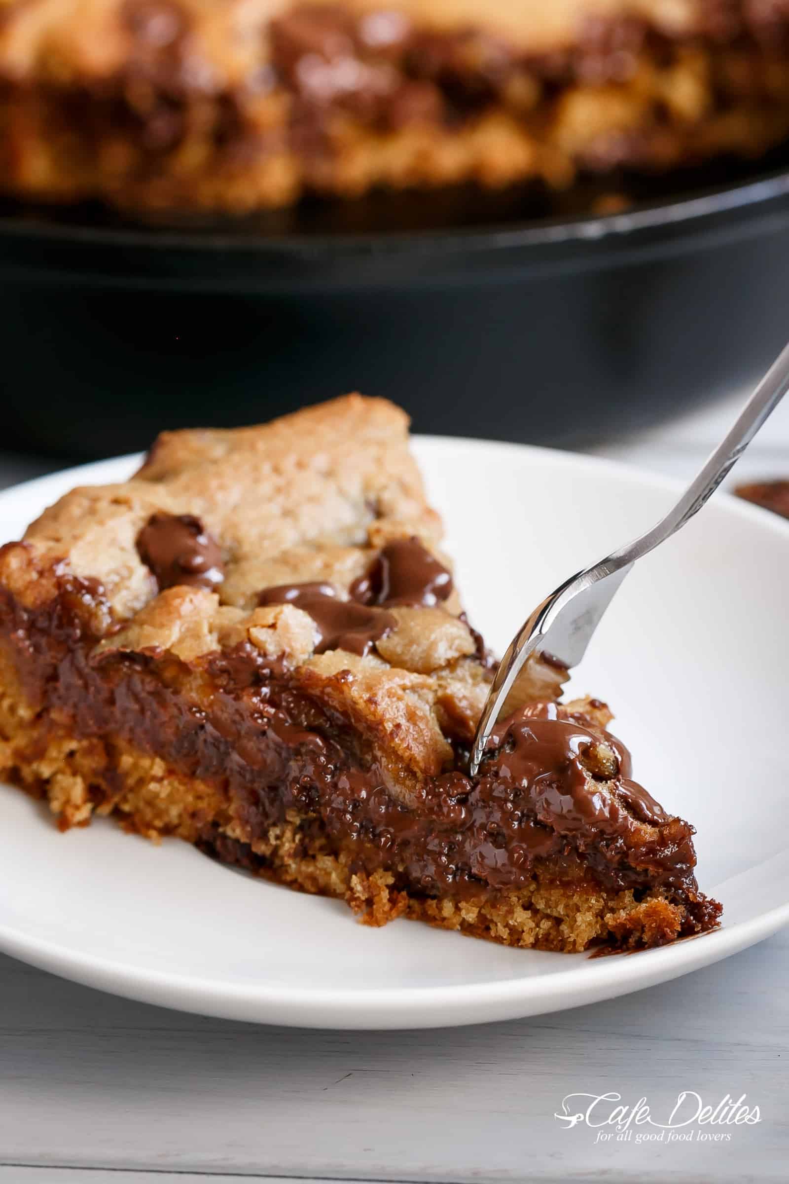 Nutella stuffed deep dish chocolate chip skillet cookie on a plate