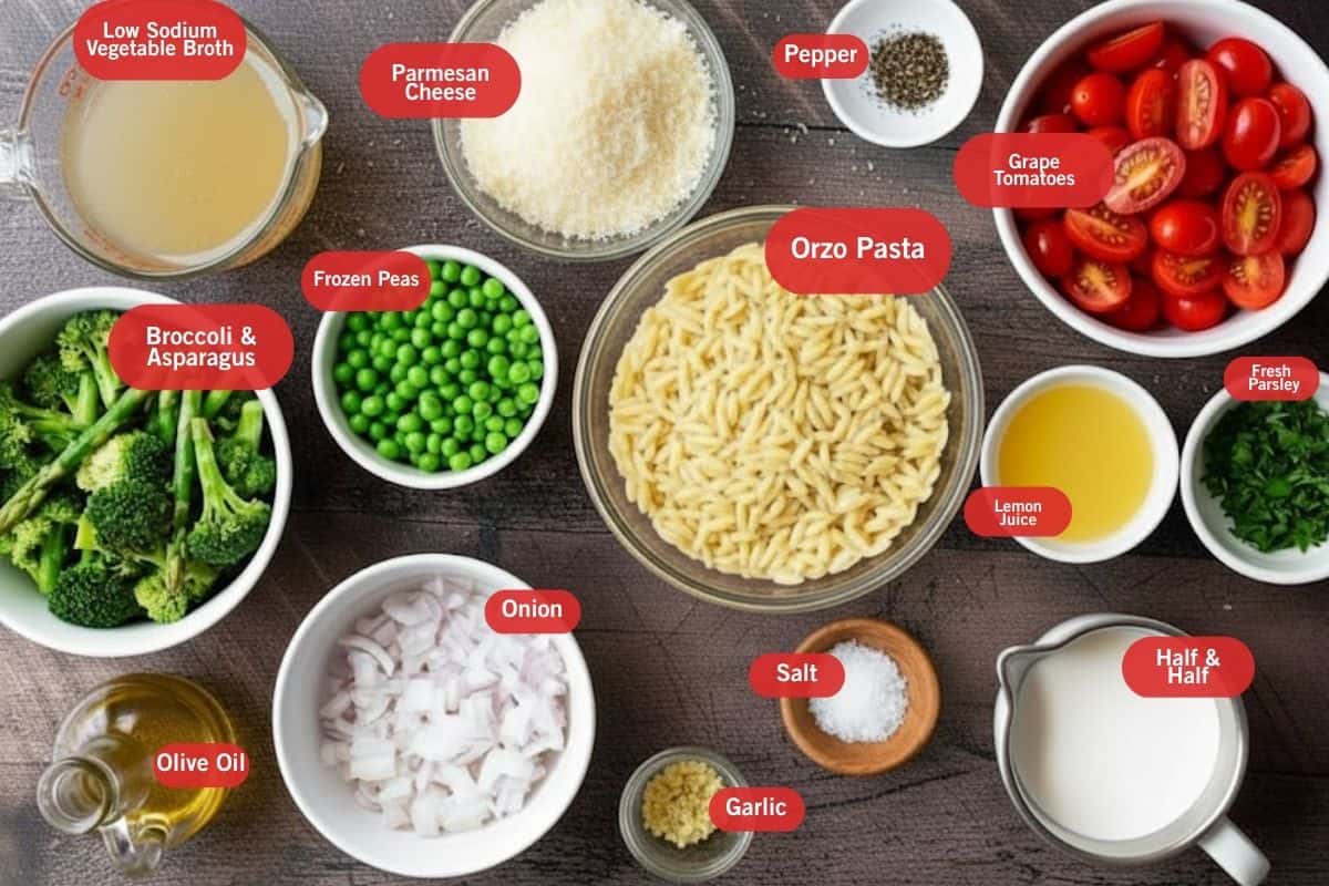 Flat lay photo of ingredient shot of low sodium vegetable broth, parmesan cheese, pepper, grape tomatoes, broccoli and asparagus, orzo pasta, lemon juice, fresh parsley, olive oil, onion, garlic, salt, half & half