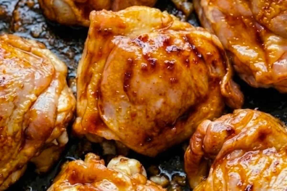 Heat the peanut oil in a large skillet over high heat and sear the chicken thighs for 4 to 5 minutes per side until deeply browned.
