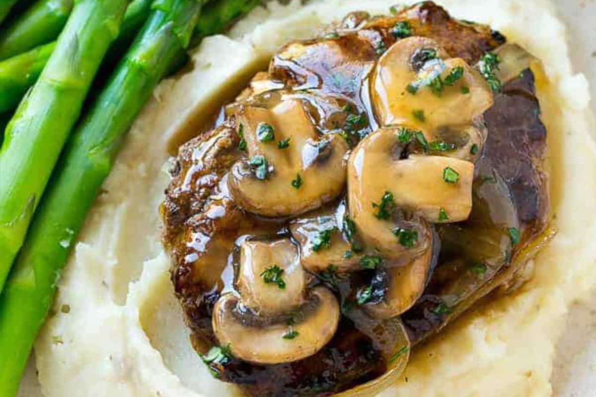 Close-up shot of Salisbury Steak with Mushroom Gravy.