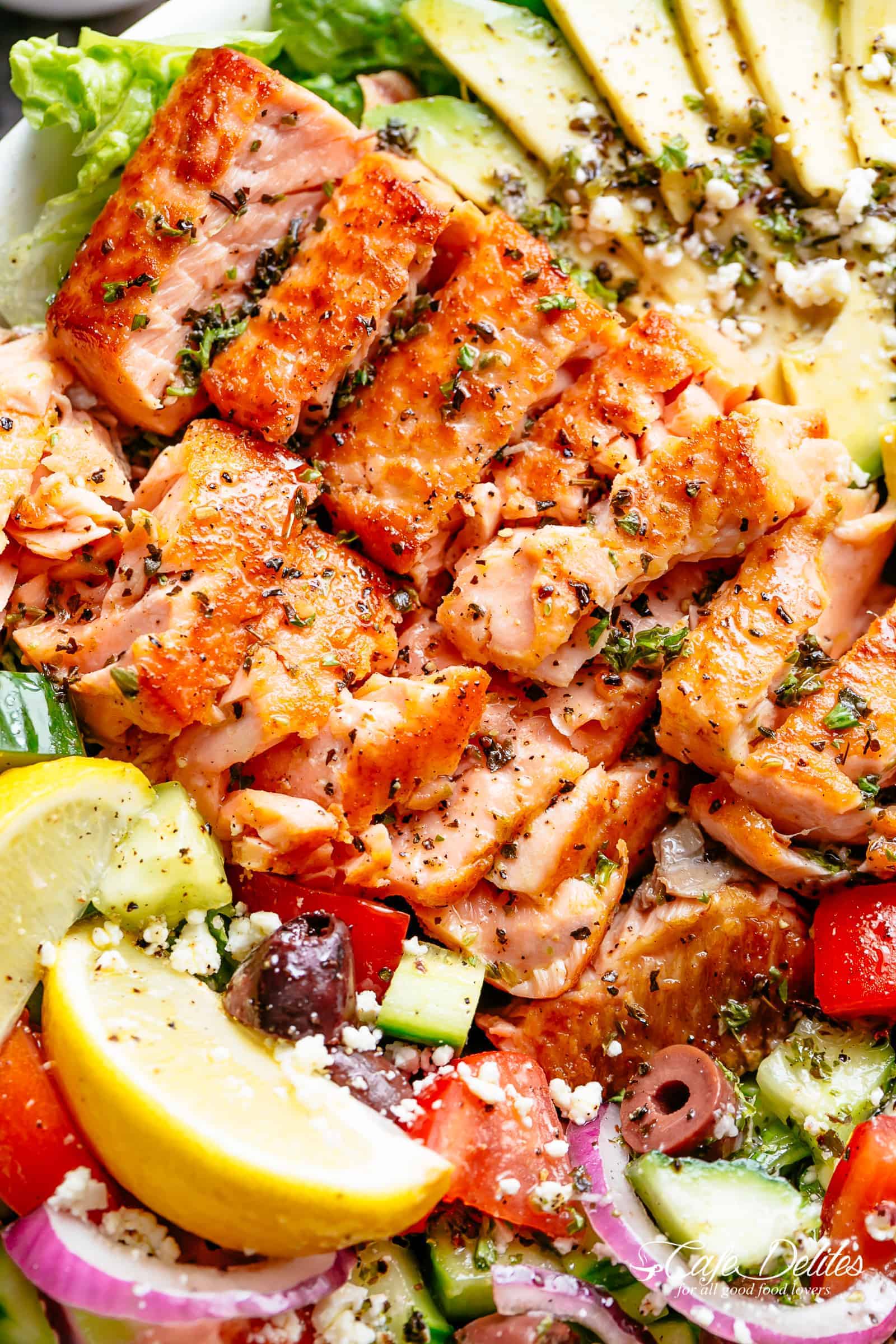 Avocado Salmon Salad with an good lemon herb Mediterranean dressing! Loaded with cucumber, olives, tomatoes and feta cheese in a pan