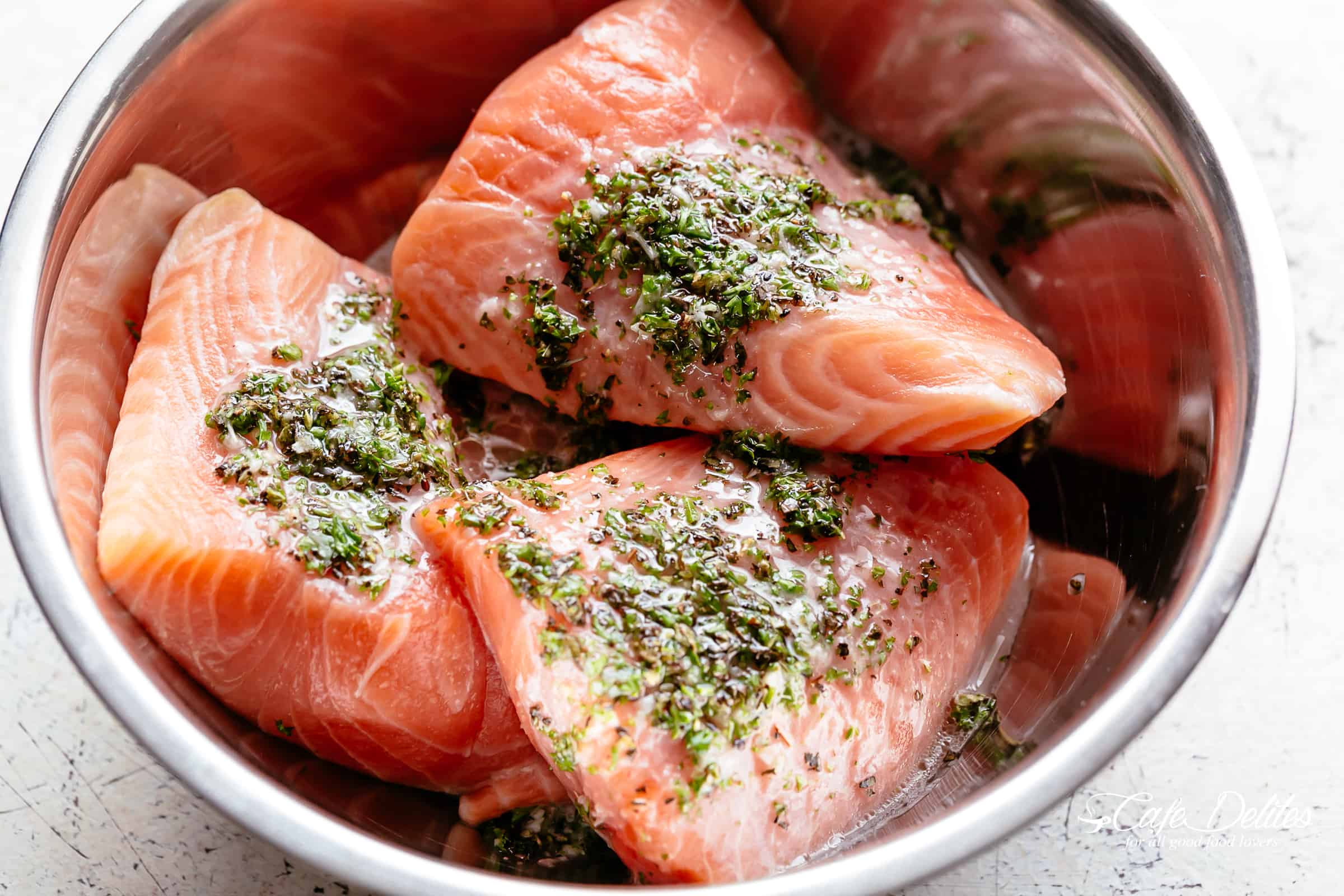 Raw Lemon Herb Avocado Salmon Salad ready to marinate
