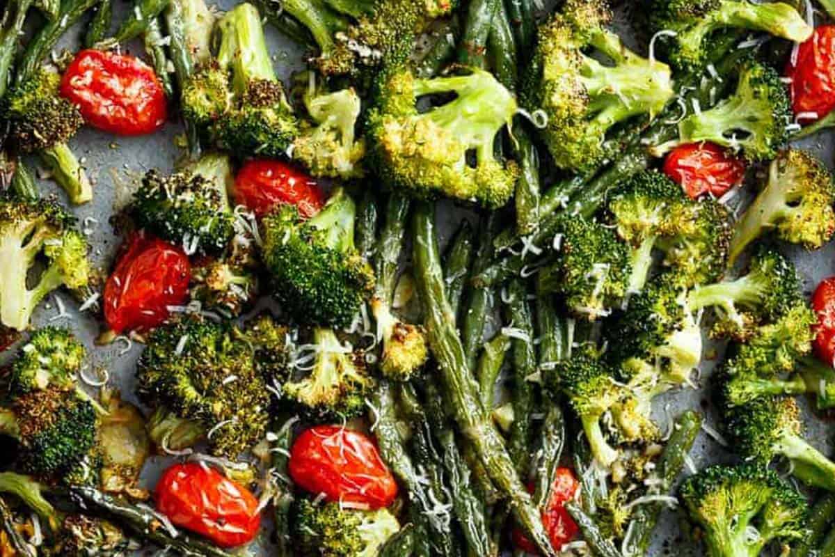 Close-up shot of Garlic Parmesan Roasted Broccoli And Green Beans.