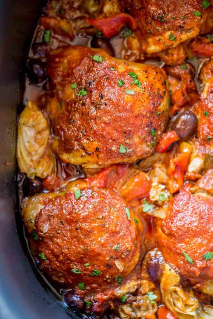 Cooked Chicken with olives and artichokes in Slow cooker.
