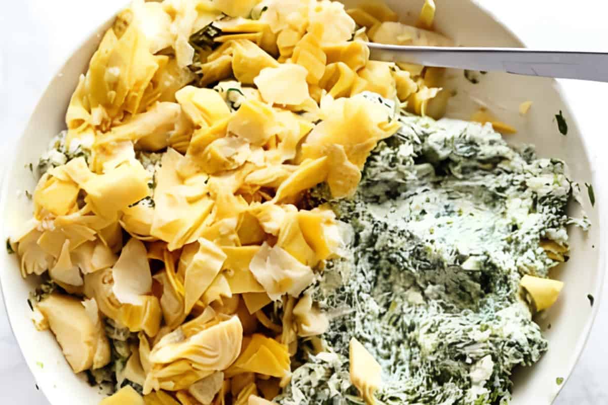 Spinach, cream cheese, chopped artichokes, mozzarella, parmesan, garlic,and pinch of salt mixed together in a bowl