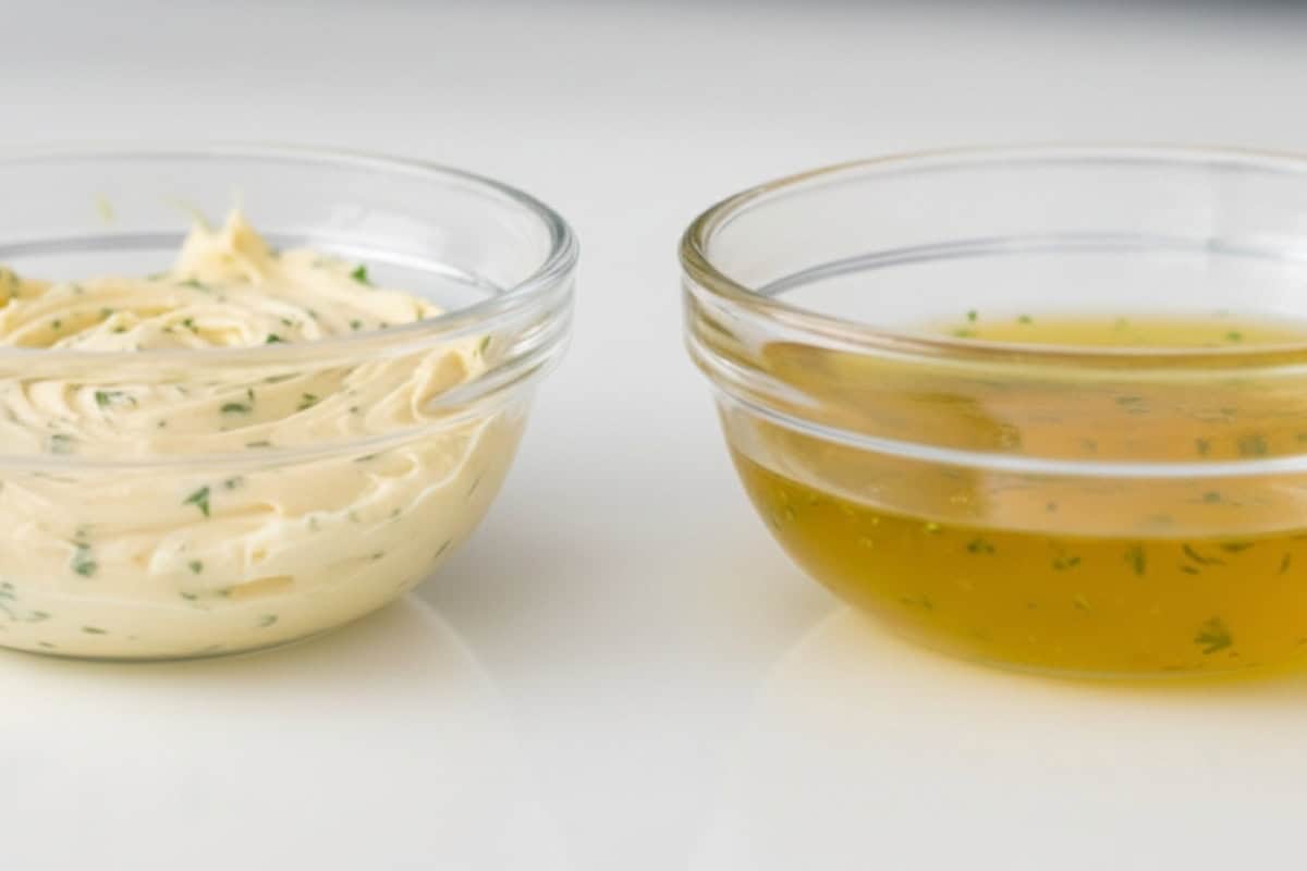 Make a batch of garlic butter, divide it into two portions, and melt one half in the microwave for 20 to 30 seconds. Keep the other half soft for coating the steak later.