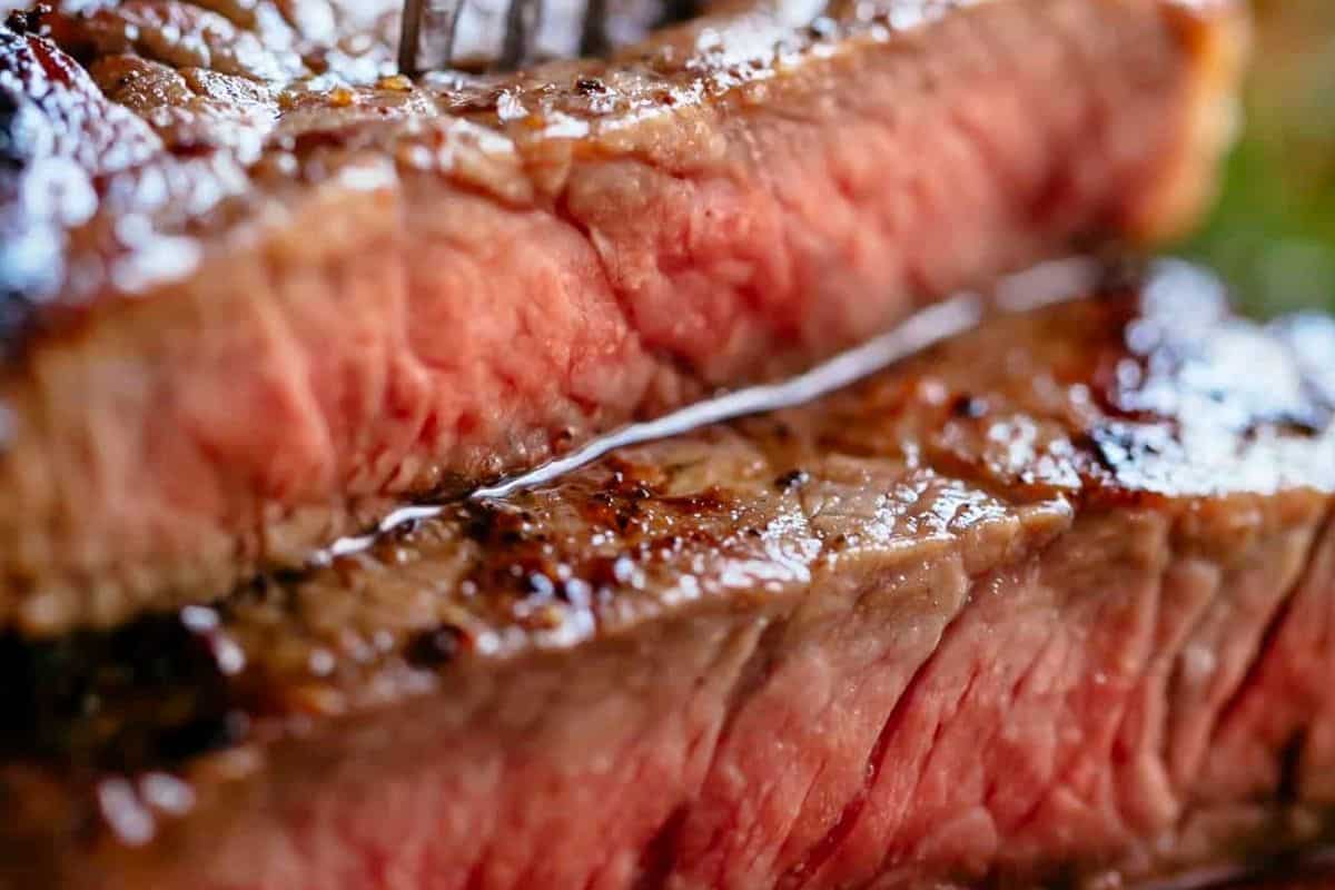 Transfer steaks to a plate, and pour the pan juices over them
