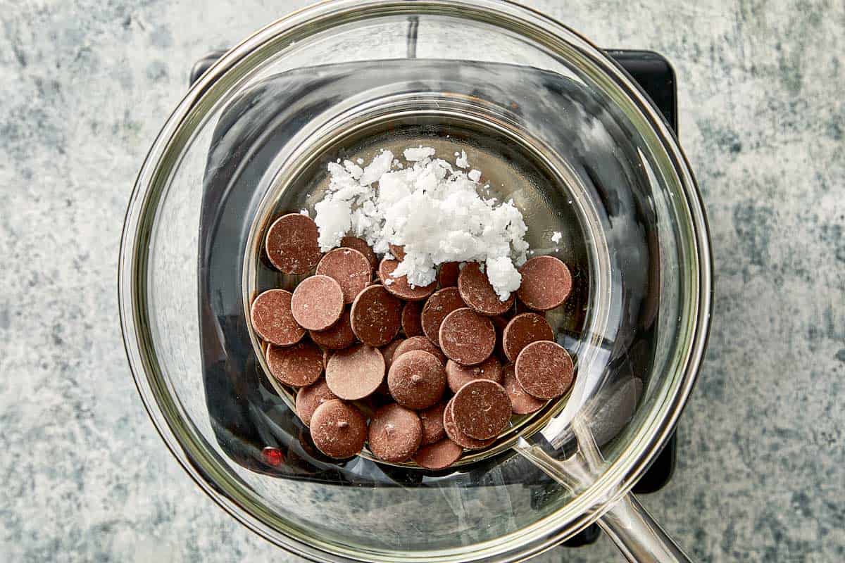 Top overview of chocolate wafers and coconut oil in a bowl.