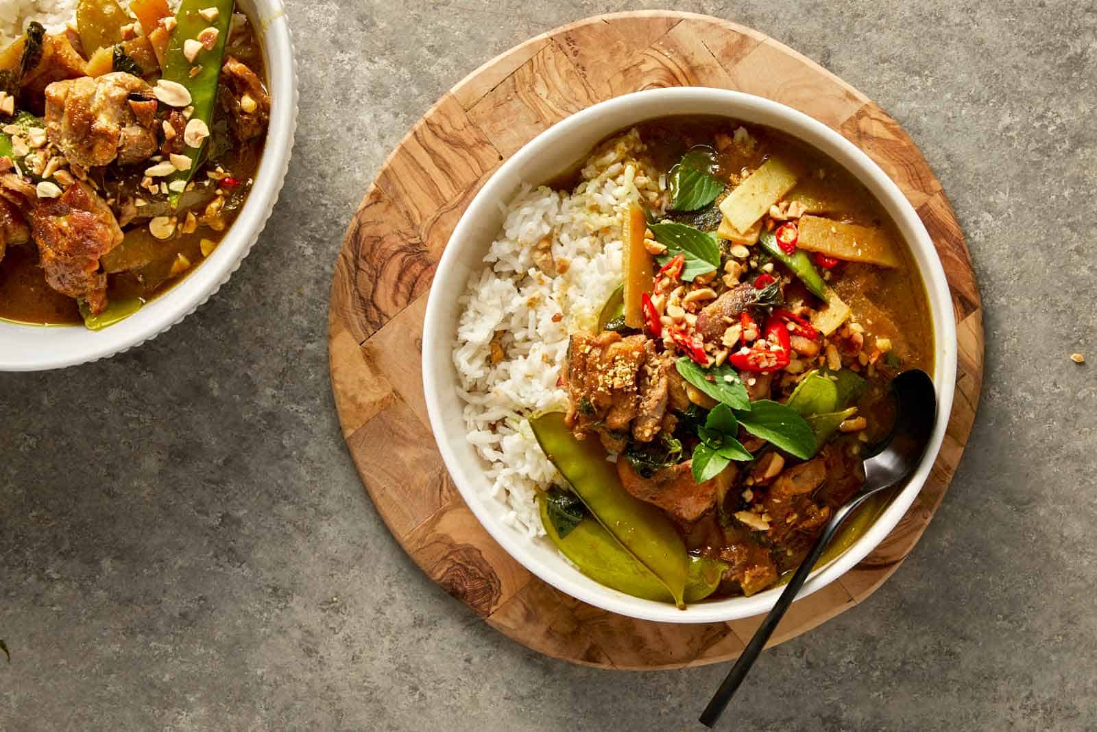 top down shot of a thai green chicken curry in a bowl