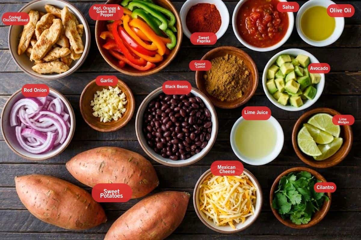 Flat lay photo of ingredient shot of twice baked sweet potatoes fajitas
(cooked chicken breast, red, green, orange bell pepper, salsa, black beans, olive oil, avocado, lime wedges, cilantro, Mexican cheese, sweet potatoes, red onion, garlic, ground cumin, sweet paprika)