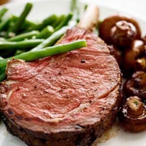 Prime Rib with garlic butter served with green beans and mushrooms