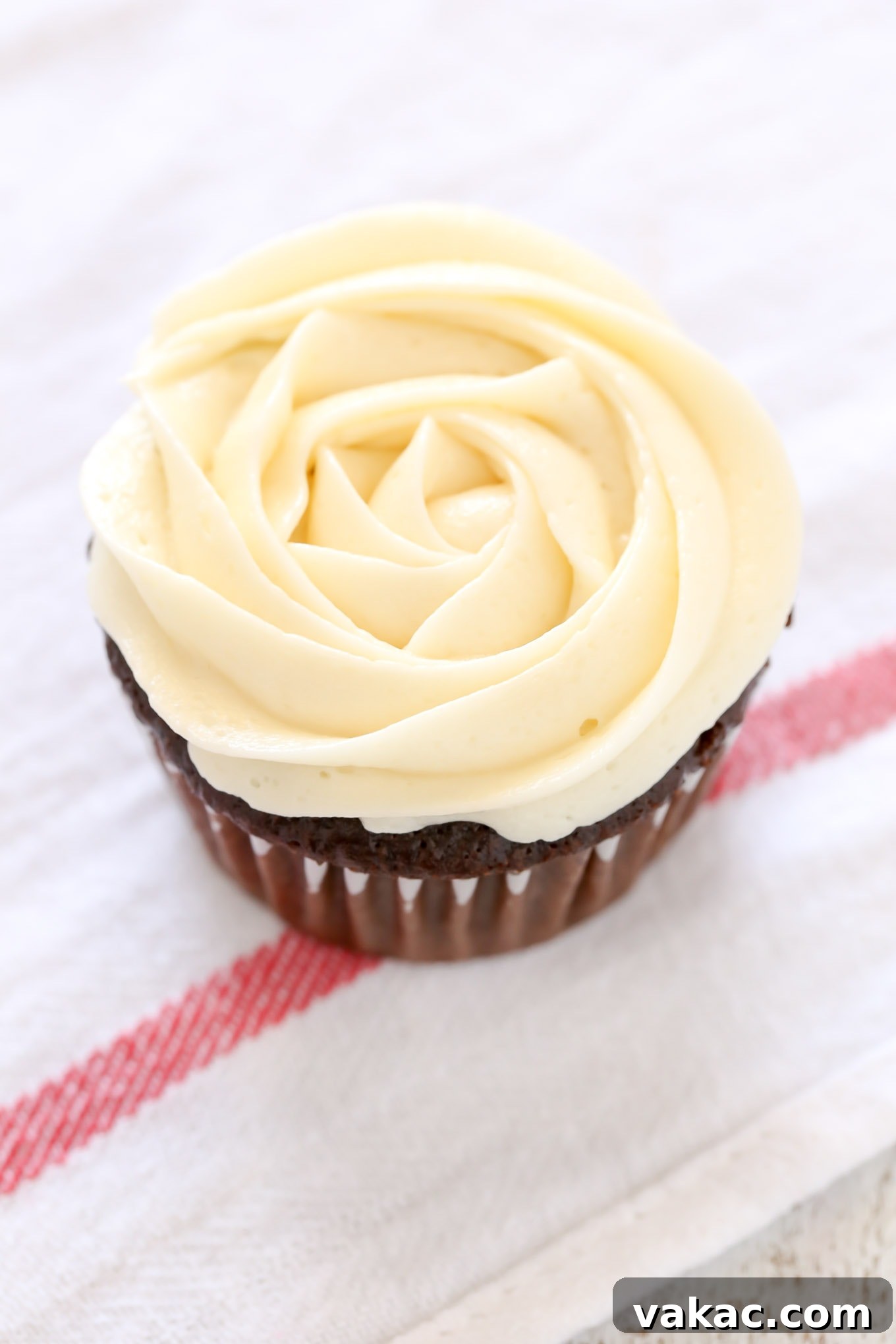 Elevate Your Cupcakes with Perfect Frosting 11 A beautifully decorated cupcake featuring a piped buttercream rose, ready to be served