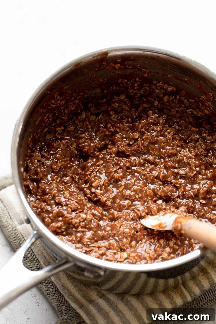 Stovetop Sweetness Made Simple 6 The finished no-bake cookie mixture after the quick-cooking oats have been thoroughly mixed into it, creating a textured batter.