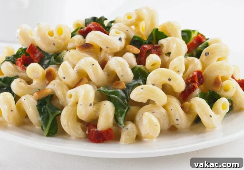 Choosing Your Perfect Pasta: A Noodle Showdown 3 Close-up of Catelli Tortiglioni Pasta mixed with vibrant Swiss Chard and Sun-Dried Tomatoes, showcasing a delicious and healthy meal.