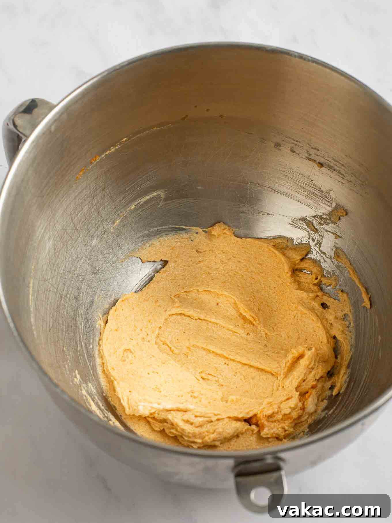 Spiced Pumpkin Snickerdoodles 5 The softened unsalted butter, granulated sugar, and brown sugar are creamed together in the bowl of a stand mixer, forming a light and fluffy mixture for the wet ingredients.