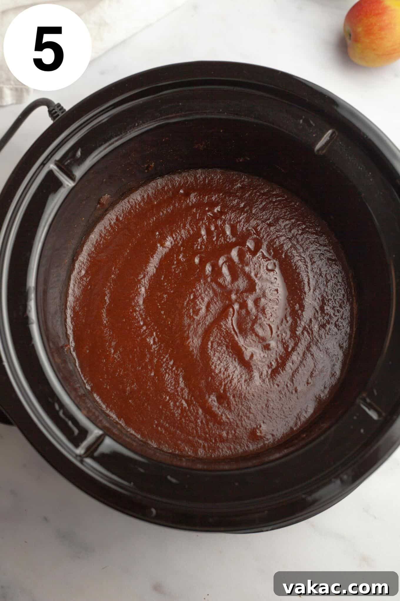 Classic Homemade Apple Butter Recipe 8 A pristine overhead shot of perfectly smooth, rich apple butter filling the slow cooker, ready for blending.
