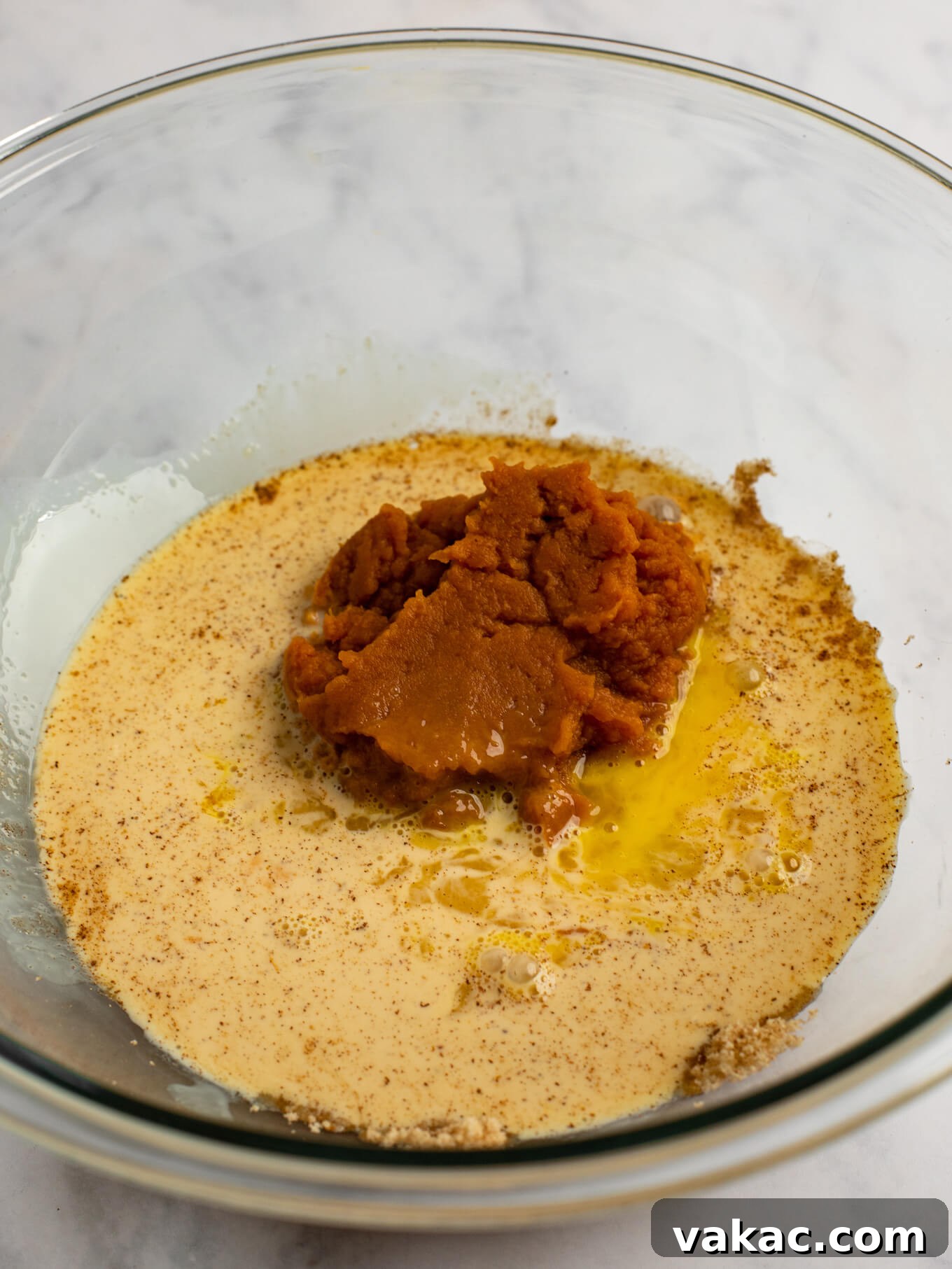 Pumpkin Pie Bites 6 The ingredients for the pumpkin pie filling in a glass mixing bowl.