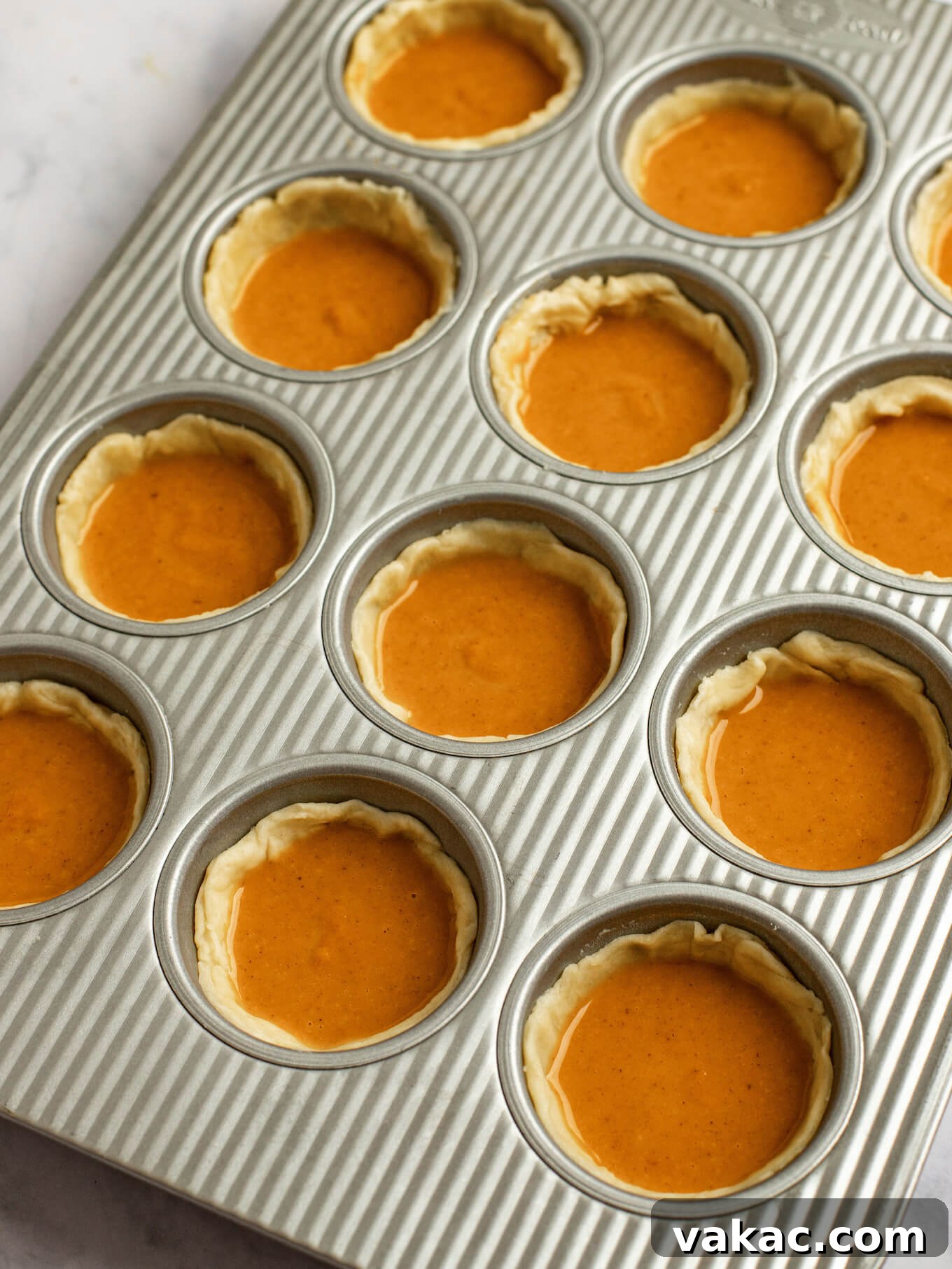 Pumpkin Pie Bites 8 Pumpkin pie filling added to the pie crusts in the muffin pan.