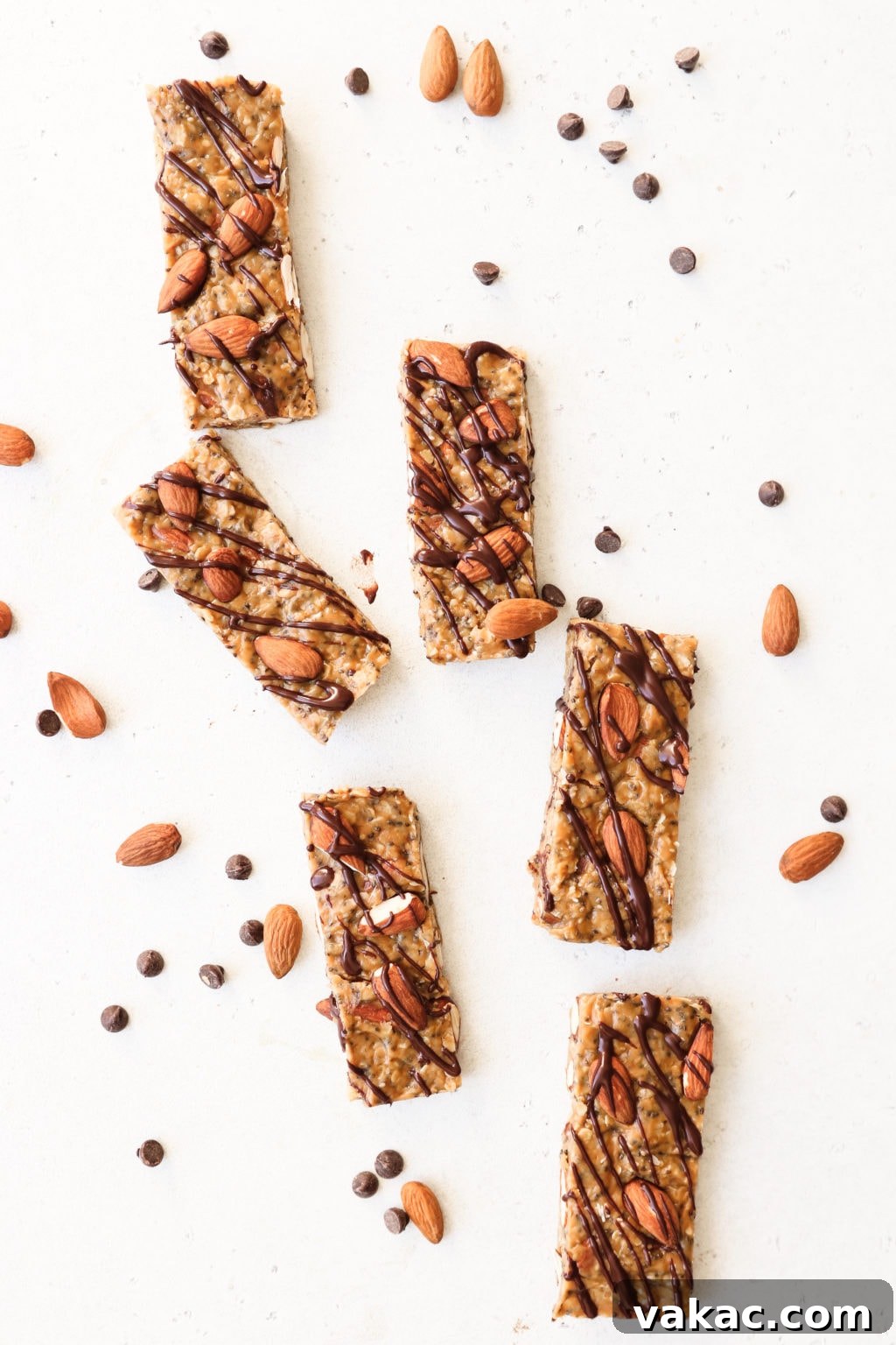 Effortless Granola Energy Bars 3 6 Granola bars are surroundedby almonds and chocolate nibs