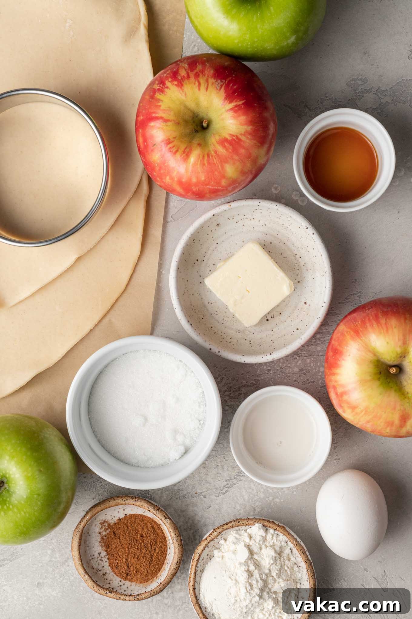 Golden Apple Pocket Pies 3 An overhead view showcasing all the fresh, high-quality ingredients neatly arranged on a counter, ready for making delicious homemade apple hand pies.