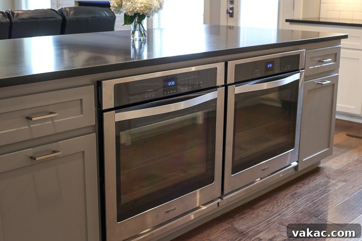 Our New Home Tour and Life Lately 4 Two modern single ovens seamlessly integrated into the kitchen island, maximizing cooking capacity and ergonomic design.