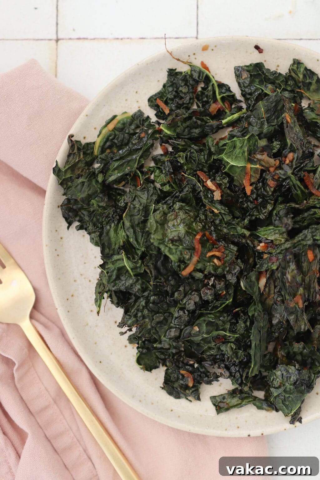 Quick Comfort: 4-Ingredient Warm Kale & Toasted Coconut Salad 10 A close-up shot of the finished warm kale salad with toasted coconut in a serving bowl.