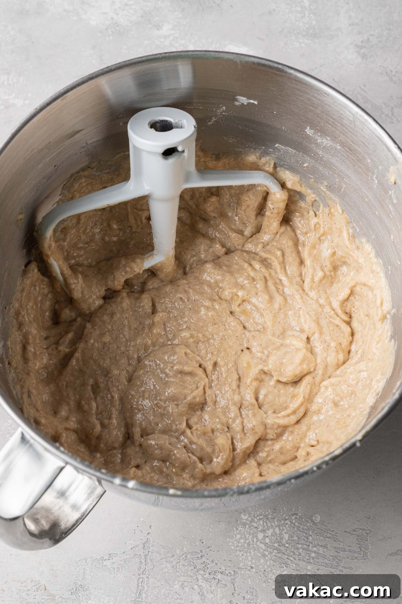 Marbled Cinnamon Banana Loaf 5 An overhead view of banana bread batter in a mixing bowl, ready for the next steps in the baking process.