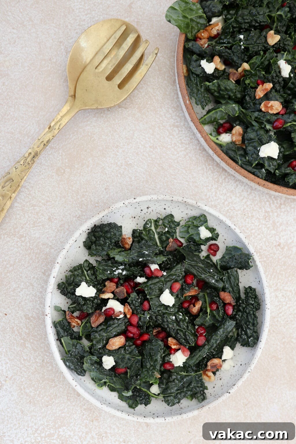 Overhead shot of the finished Kale Pomegranate Salad, beautifully plated and ready to be served.