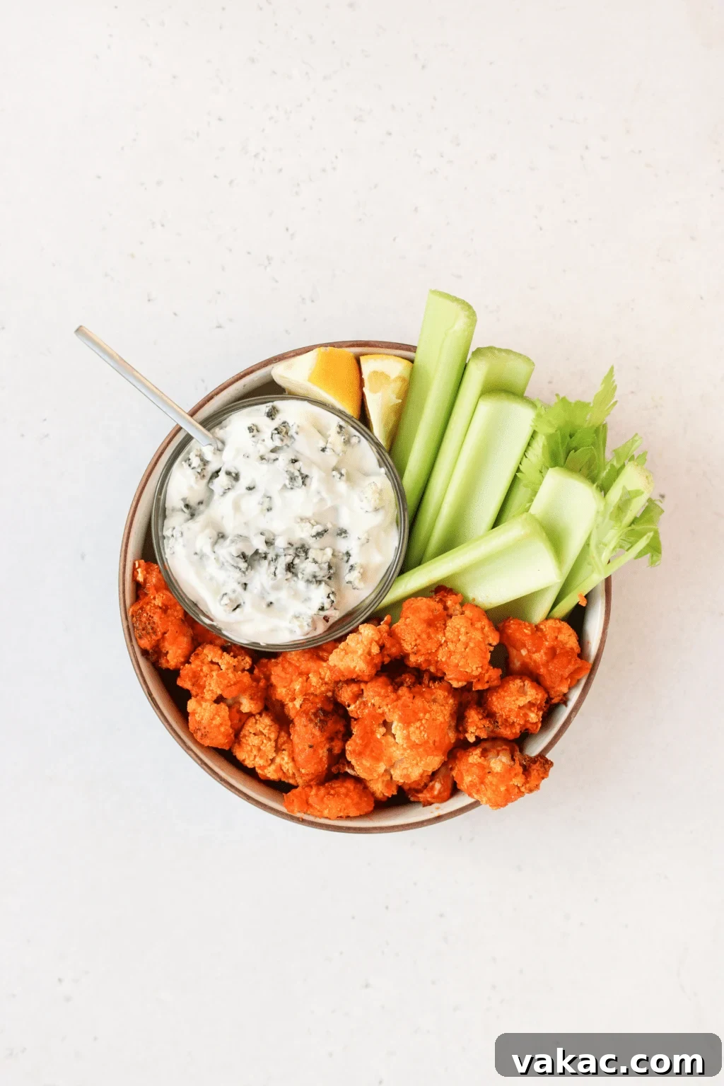 Air Fryer Buffalo Cauliflower Nuggets 6 Air frying crispy buffalo cauliflower bites in a single layer.