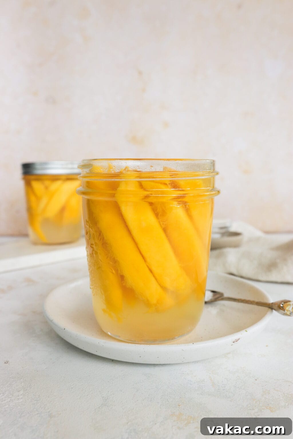 Easy Quick Pickled Mango Recipe 2 A beautiful jar of homemade quick pickled mangoes, showcasing their vibrant color and tantalizing texture.