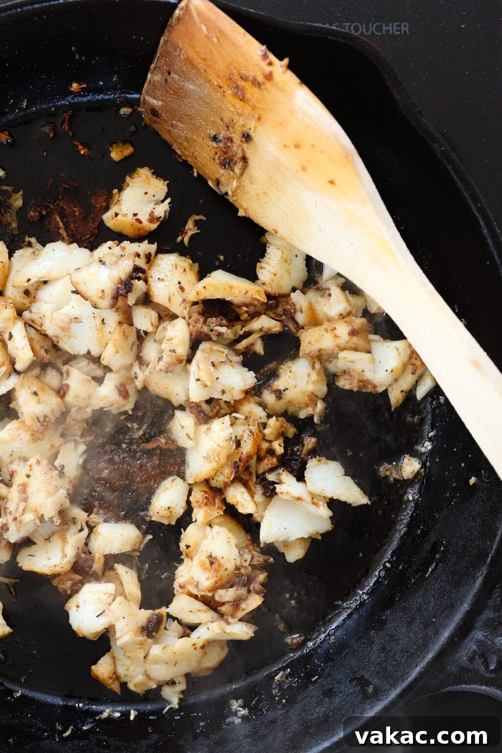 Easy 15-Minute Blackened Fish Tacos with Tangy Slaw 6 Pieces of seasoned white fish sizzling in a hot cast iron pan, developing a delicious blackened crust.