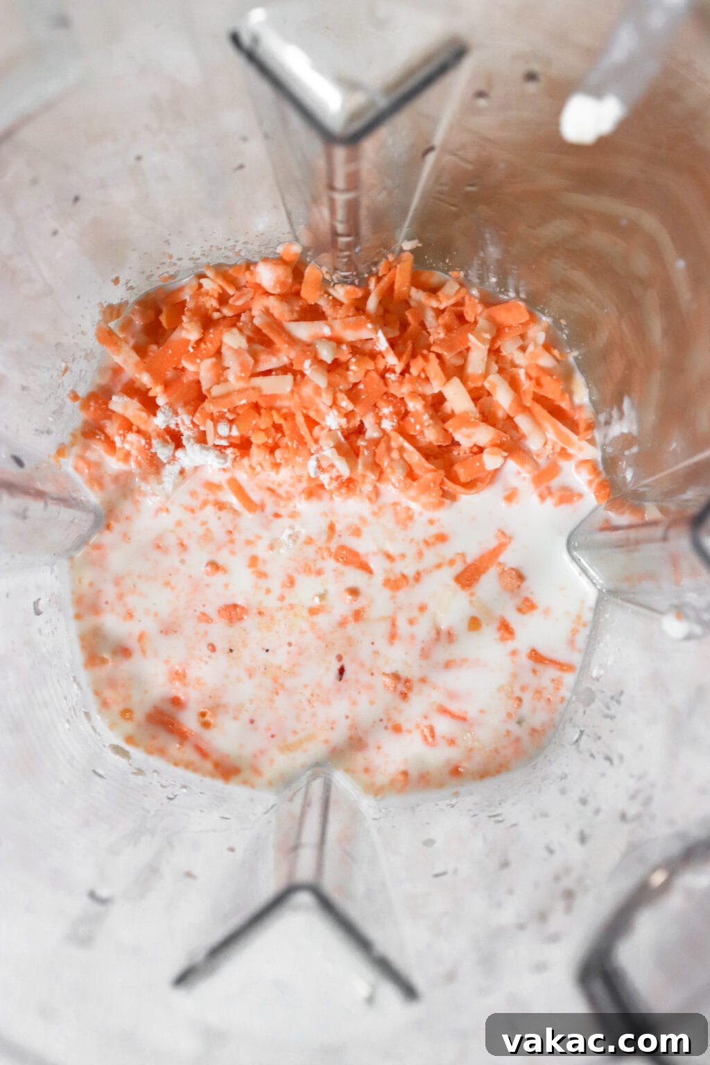 Secretly Creamy 5-Ingredient Cottage Cheese Mac 4 Unblended ingredients for 5 Ingredient Creamy Cottage Cheese Mac and Cheese in a blender
