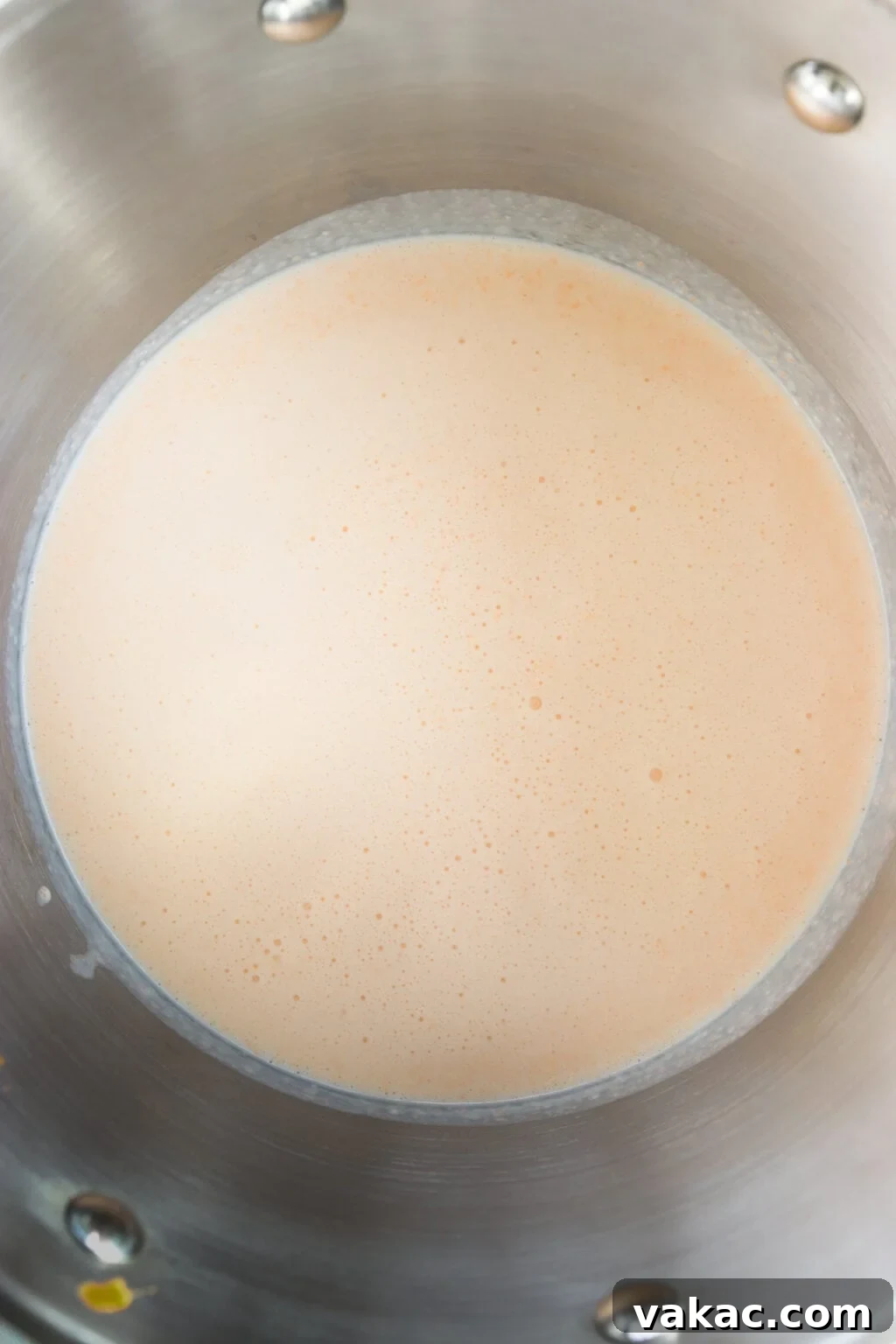 Secretly Creamy 5-Ingredient Cottage Cheese Mac 6 Blended ingredients for 5 Ingredient Creamy Cottage Cheese Mac and Cheese in a metal pot.