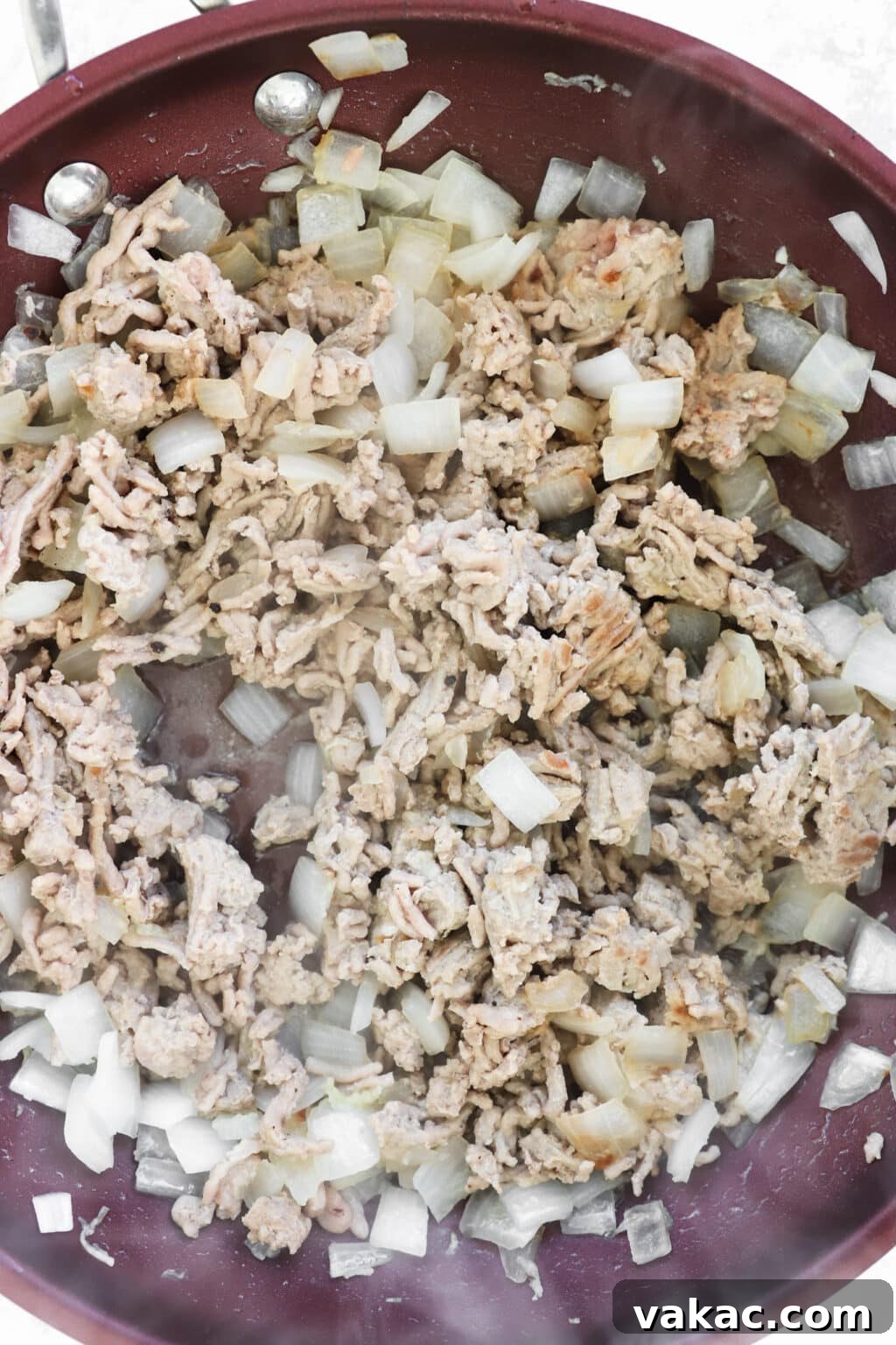 Comforting Slow Cooker Sweet Potato and Turkey Chili 4 Ground turkey browning in a large frying pan with sautéed garlic and onion, preparing for slow cooker chili.