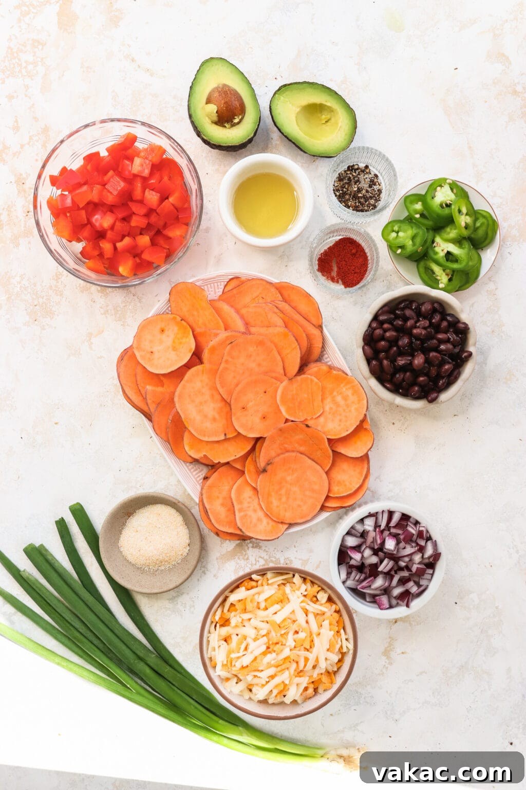 Healthy Sweet Potato Nachos with Black Beans and Bell Peppers 3 Ingredients for Healthy Black Bean & Bell Pepper Sweet Potato Nachos, including sweet potatoes, avocado oil, pepper, paprika, garlic salt, nacho cheese blend, black beans, bell peppers, red onion, jalapeno, green onion, avocado, sour cream, salsa