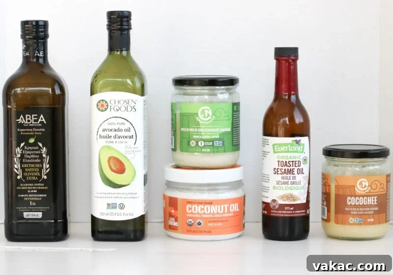 7 Must-Know Cooking Oils: The Ultimate Comparison 2 Various cooking oils, including olive, avocado, and coconut, in a kitchen setting.