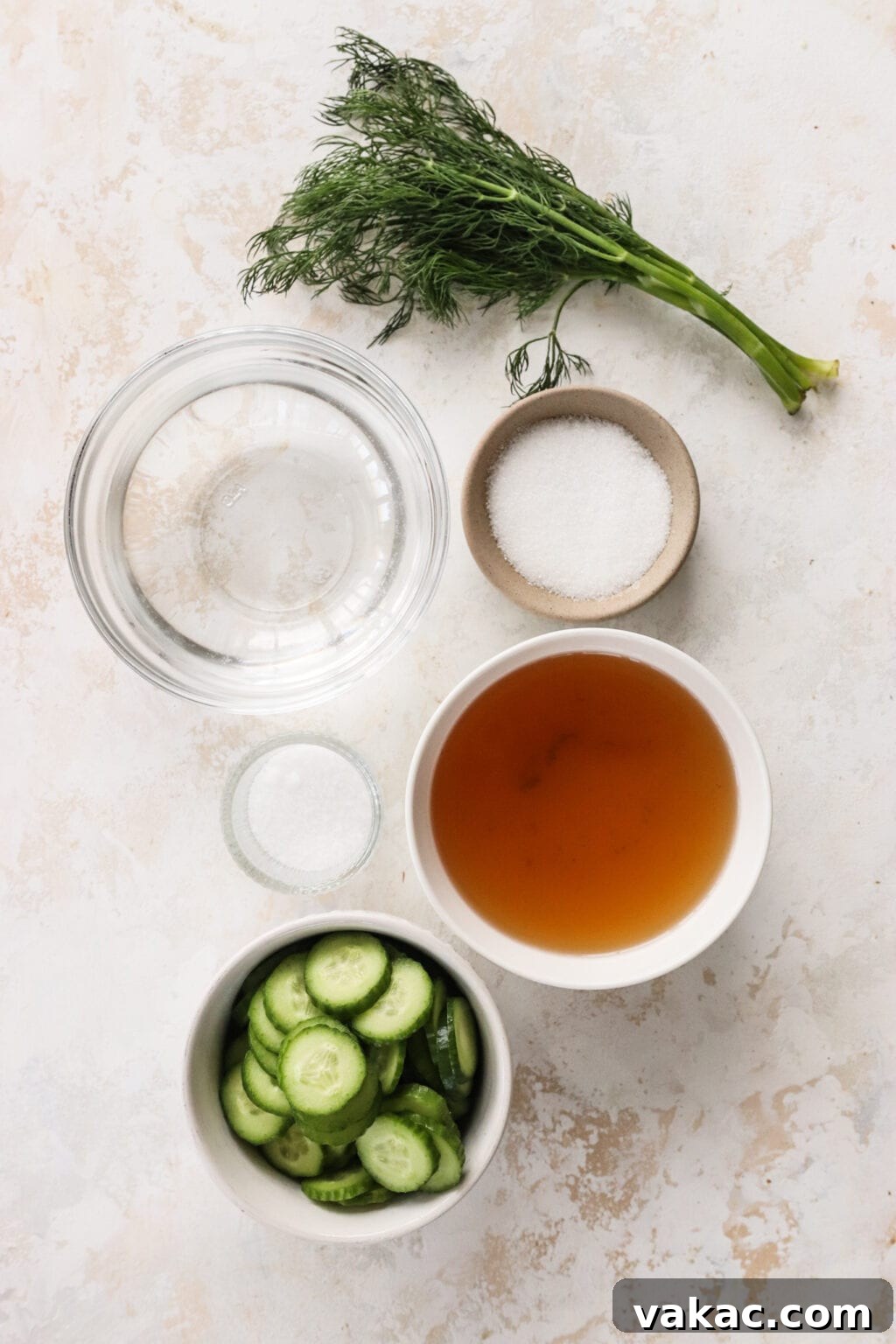 Zesty Apple Cider Vinegar Dill Pickles 4 Ingredients for Apple Cider Vinegar Cucumber Pickles with Dill in small bowls, including cucumbers, hot water, apple cider vinegar or white vinegar, salt, sugar, fresh dill