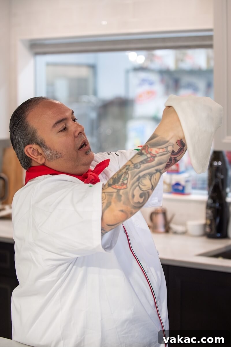Sourdough Stars with Red Star 5 A professional chef demonstrates the proper technique for stretching pizza dough by hand.