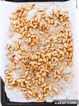 Prep ahead roasted cajun spice white beans on a baking sheet lined with parchment paper