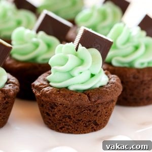 A top-down view of a completed Mint Chocolate Cookie Cup, showcasing the vibrant green frosting and Andes mint topping.
