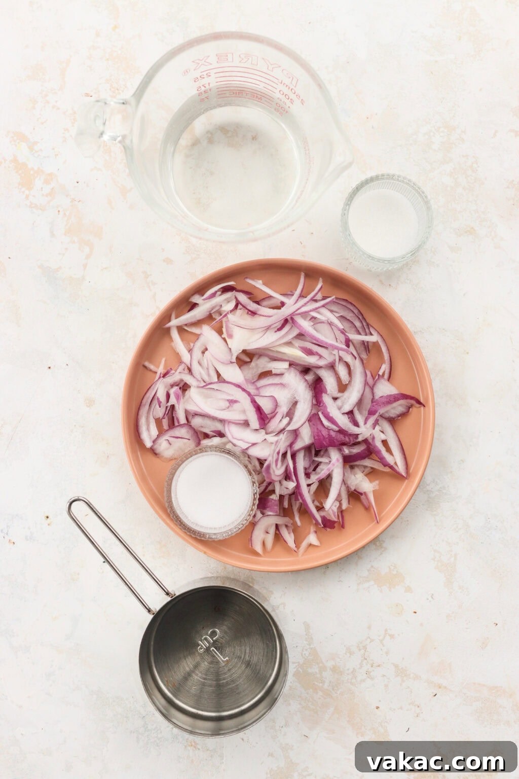 Whip Up Tangy Quick Pickled Red Onions 3 Ingredients for quick pickled red onions, including red onions, salt, sugar, vinegar, and hot water