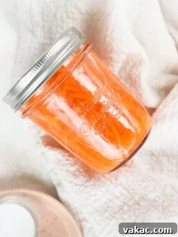 Quick pickled shredded carrots in a glass jar