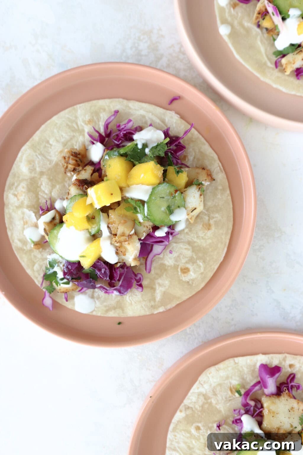 Quick Pickled Red Cabbage Made Easy 8 A bowl of tacos garnished with fresh cilantro and a side of quick pickled red cabbage, demonstrating its use as a vibrant topping