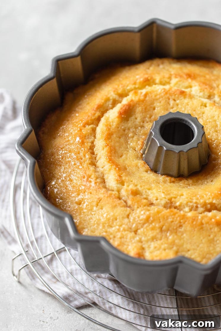 Golden Rum Cake Delight 5 A close up of the finished cake with glazed poured over the top while still in the pan.