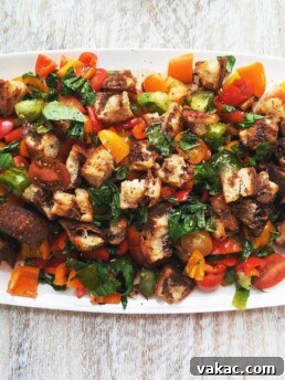 Close-up of a bowl of Panzanella Salad with fresh ingredients