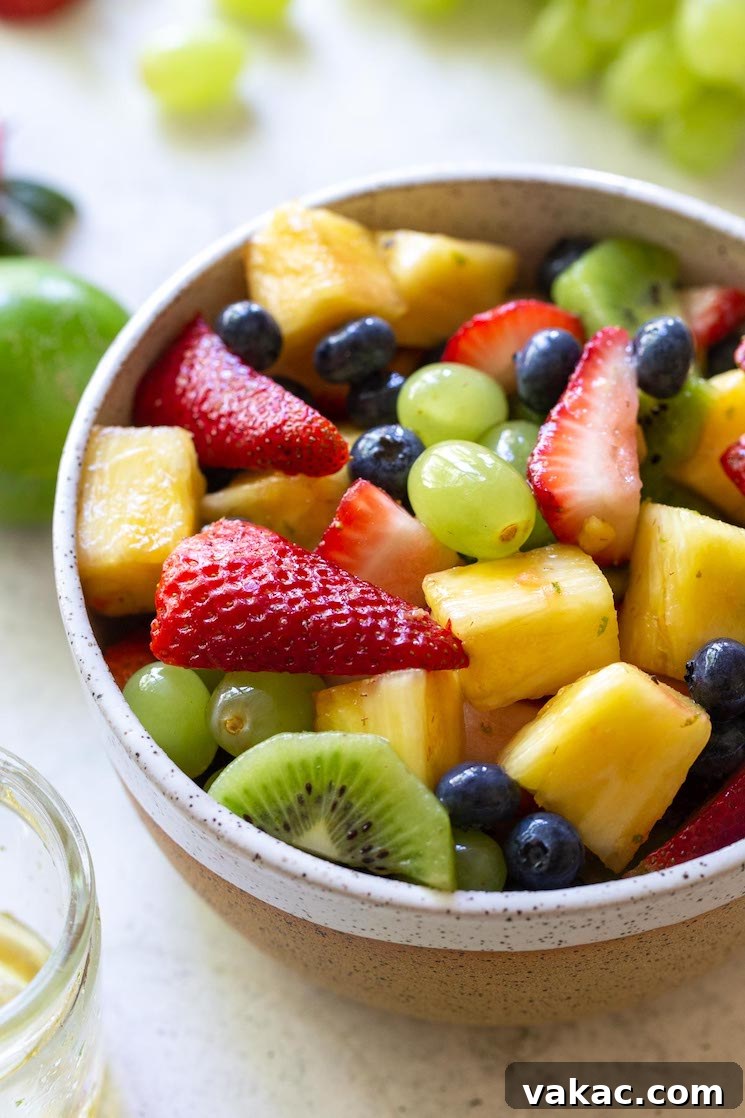 Sun Kissed Fruit Delight 2 A rustic clay bowl generously filled with a vibrant mix of fresh fruit salad, garnished with a hint of citrus zest.