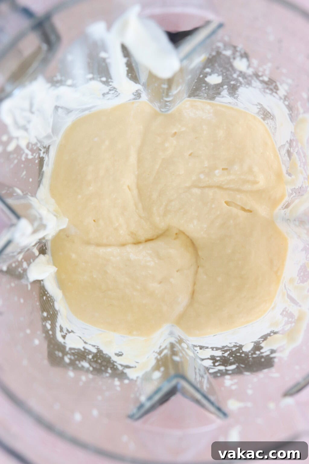 Paradise Protein Greek Yogurt Bowl 5 Ingredients for high protein tropical smoothie bowl with Greek Yogurt blended in a blender, including Greek Yogurt, mango, riced cauliflower, lime juice, milk of choice
